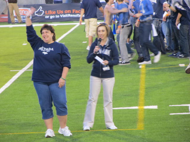 Kate Camino being honored on the field at UNR's first football game (Photo Argaia) 